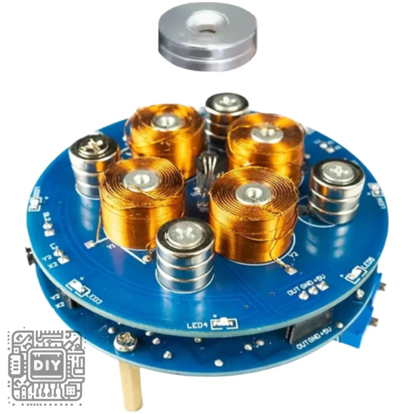 Blue circular circuit board populated with several orange copper coils and silver inductors; a detached metal spacer sits above the assembly